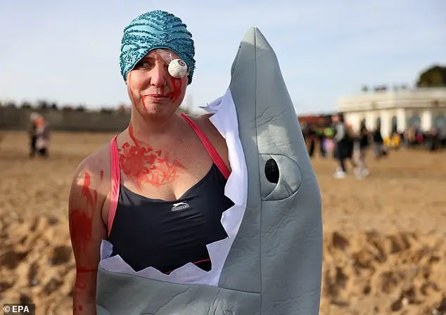 Hundreds of swimmers brave icy waters for traditional New Year’s Day dip in Whitley Bay, North Tyneside